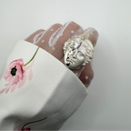 signet pinky ring, Aphrodite statue. Witchy rings.